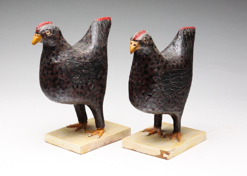 PAIR OF FOLK ART CHICKENS BY CARL SCHARVER.: American, late 20th century. Signed on the underside, one dated 1987. Carved wooden standing chickens with original paint and glass eyes. 7", 7.25"h.