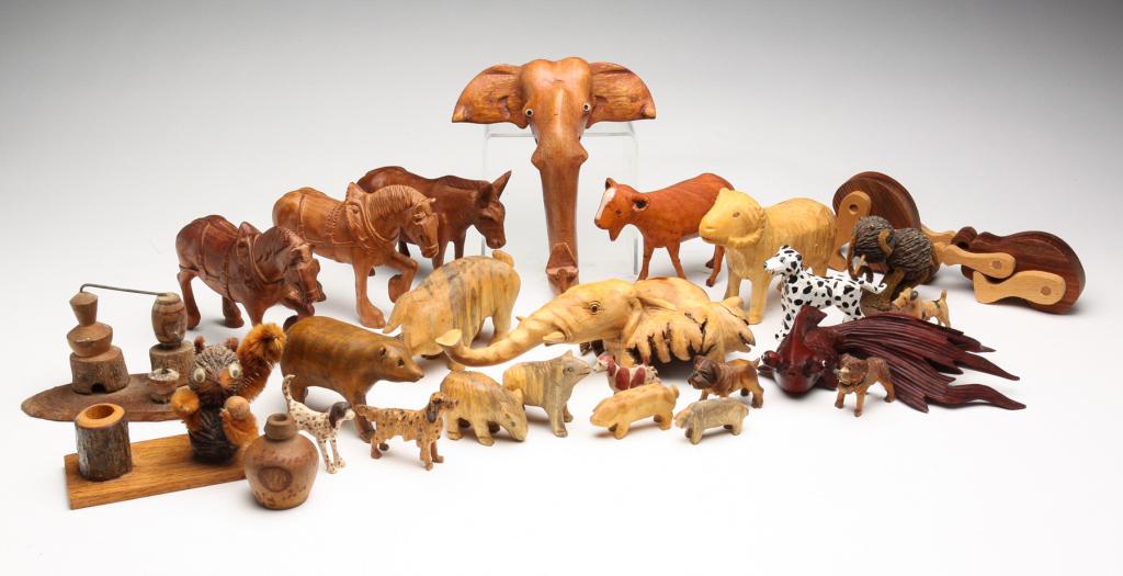 ASSORTMENT OF CARVED ANIMALS AND NOVELTIES.: Twentieth century. Horses, goats, elephants and more. Several by Kivel Weaver, one by Lloyd Ball and several with initials.