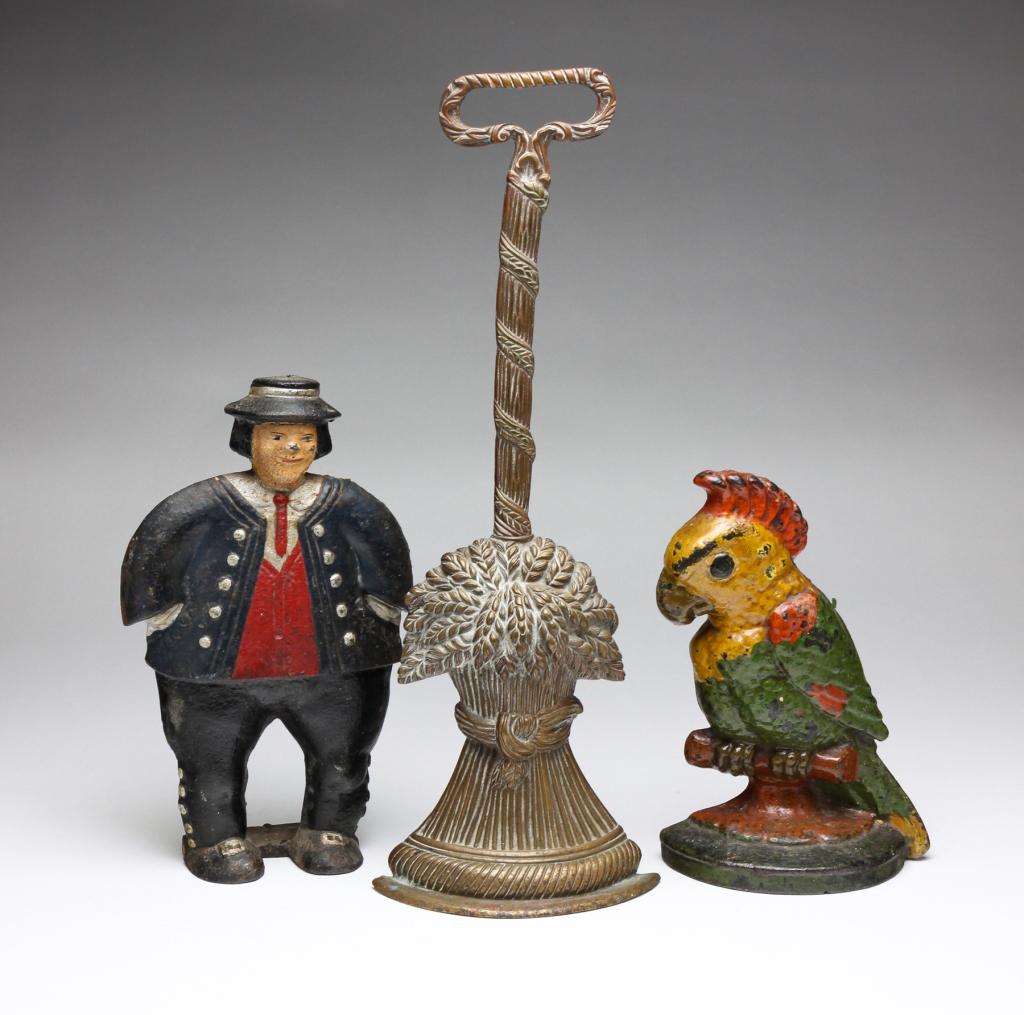 THREE AMERICAN DOORSTOPS. (1 of 7)