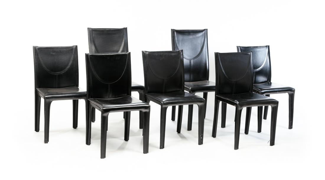 SEVEN ITALIAN ARPER DINING CHAIRS.: Late 20th century. Molded plastic covered with black leather. Six have paper and/or molded labels "Arper, Made in Italy". Minor wear, surface scuffs, one larger chair has broken joint at back legs. Tw