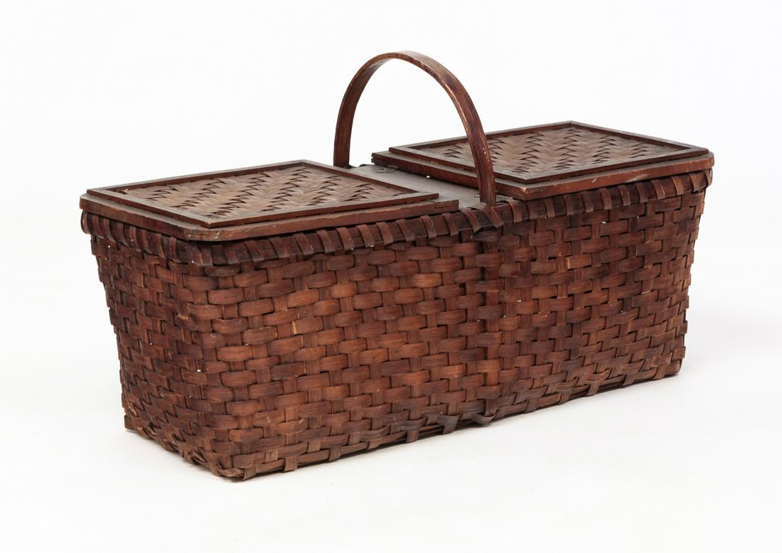 AMERICAN PICNIC BASKET.: Twentieth century, oak. Splint construction, double hinged lids and bale handle. Some wear. 18"h. 32"w. 12.75"d.