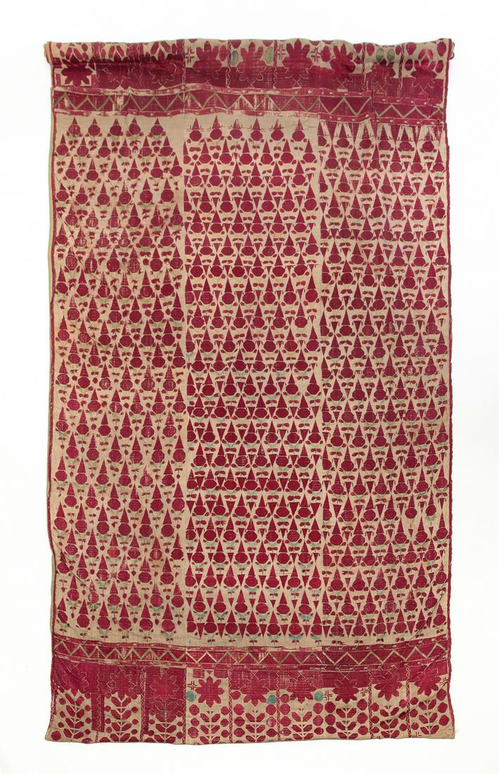 EMBROIDERED TEXTILE PANEL.: Possibly Eastern, 2nd half-19th century. Hand sewn repeating design in red silk on linen ground. Green silk backing. Wear and areas of stitching loss. 101"h. 52"w.