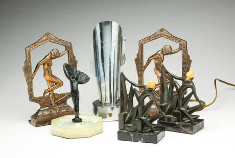 SIX AMERICAN ART DECO STYLE BOOKENDS ETC.: Mid 20th century. Onyx ashtray with spelter dancer and fan. Wear, 6.5"h., tin lamp with woman's face and shield "Zhta XI", and two pair of bookends with dancers. Bronze with marble bases and molded re