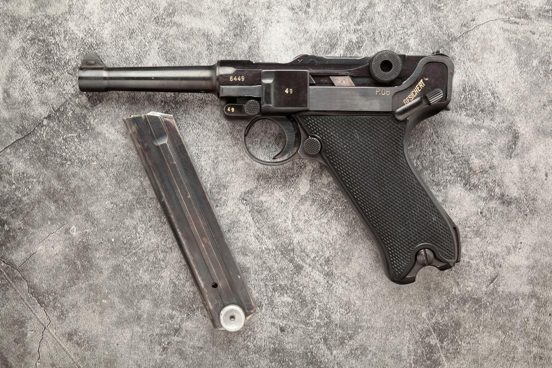 LUGER "BLACK WIDOW" P.08 9MM SEMI AUTOMATIC PISTOL: Luger P.08 "Black Widow" 9mm semi automatic pistol. Checkered plastic grips with blued frame and barrel. Matching serial numbers throughout including magazine: 6449. 4" barrel length, 8-1/2" overall. 