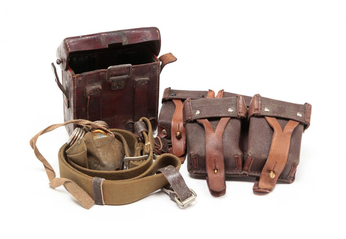 GROUP OF LEATHER AMMO AND OILER POUCHES: Group of leather ammunition boxes containing field tools and oilers.