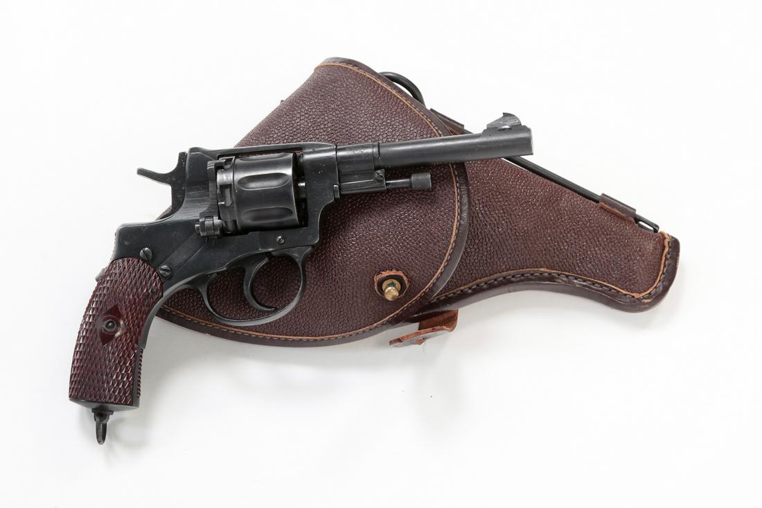 NAGANT MODEL 1895 7.62X38R DOUBLE ACTION REVOLVER: Nagant Model 1895 7.62X38R double action revolver. Manufactured in 1932. Checkered grips with possible refinish to frame, barrel and fluted cylinder. 4-1/2" barrel length, 9" overall. Serial number 24