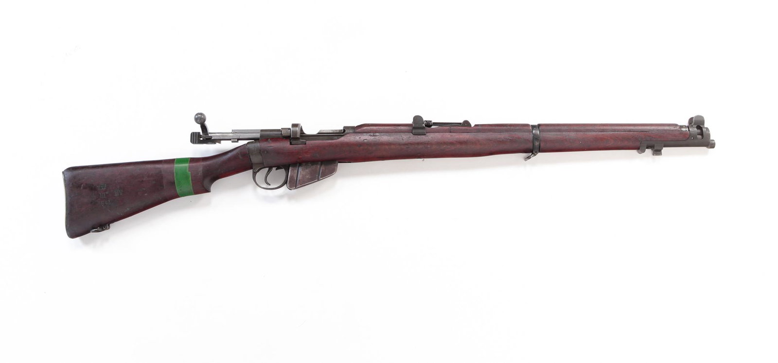 LEE ENFIELD SMLE 1942 MKIII .303 BOLT ACTION RIFLE: Lee Enfield SMLE 1942 Mark III .303 caliber bolt action rifle. Wooden stock with green tape on butt. 25-1/2" barrel length, 44-1/4" overall. Serial number E 1601. Requires ATF form 4473.