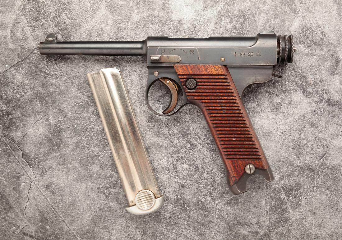 JAPANESE NAMBU 11.3 TYPE 14 8MM SEMI AUTO PISTOL: Japanese Nambu 11.3 Type 14 8mm semi automatic pistol. Wooden grips with blued frame and barrel. 4-1/2" barrel, 8-1/2" overall. Matching serial numbers including magazine: 19747. Overall excellent con