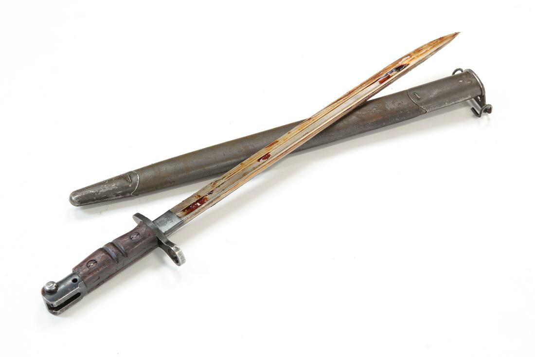 WWI U.S. M1917 REMINGTON BAYONET WITH SCABBARD: 1917 Remington bayonet with scabbard. Wooden handle. 17" blade length, 21-3/4" overall.