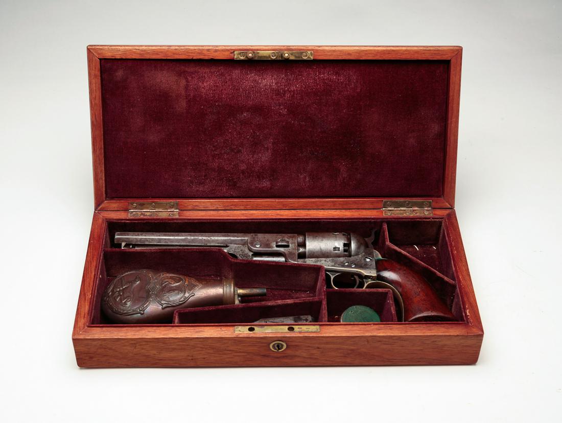 COLT 1851 NAVY .36 CALIBER SINGLE ACTION REVOLVER: Colt model 1851 Navy .36 caliber single action revolver. Smooth walnut grips with steel frame and cylinder. Matching serial numbers: 31522. 7-1/2" barrel length, 13-1/5" overall. Together with a felt 