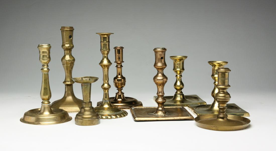 NINE EUROPEAN BRASS CANDLESTICKS. (1 of 5)