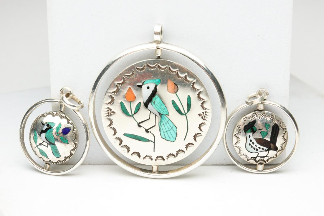 SILVER INLAY NATIVE AMERICAN SPINNER PENDANTS. (1 of 4)