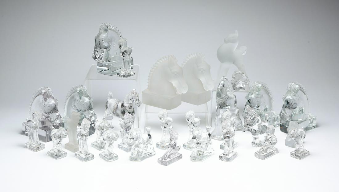 COLLECTION OF MOSTLY HEISEY PONIES.: Second quarter 20th Century. Mostly clear with several frosted. Bookends, standing, kicking, prancing and busts.