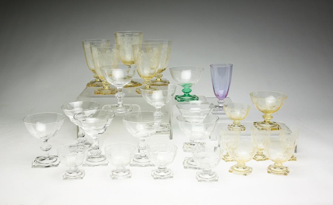 COLLECTION OF HEISEY "CARCASSONNE" STEMS.: Second quarter 20th century. Etched Sahara including a water goblet, four goblets, a sherbet, three cordials, and three small pieces. Clear including four etched small pieces and eight tall sherbets, 