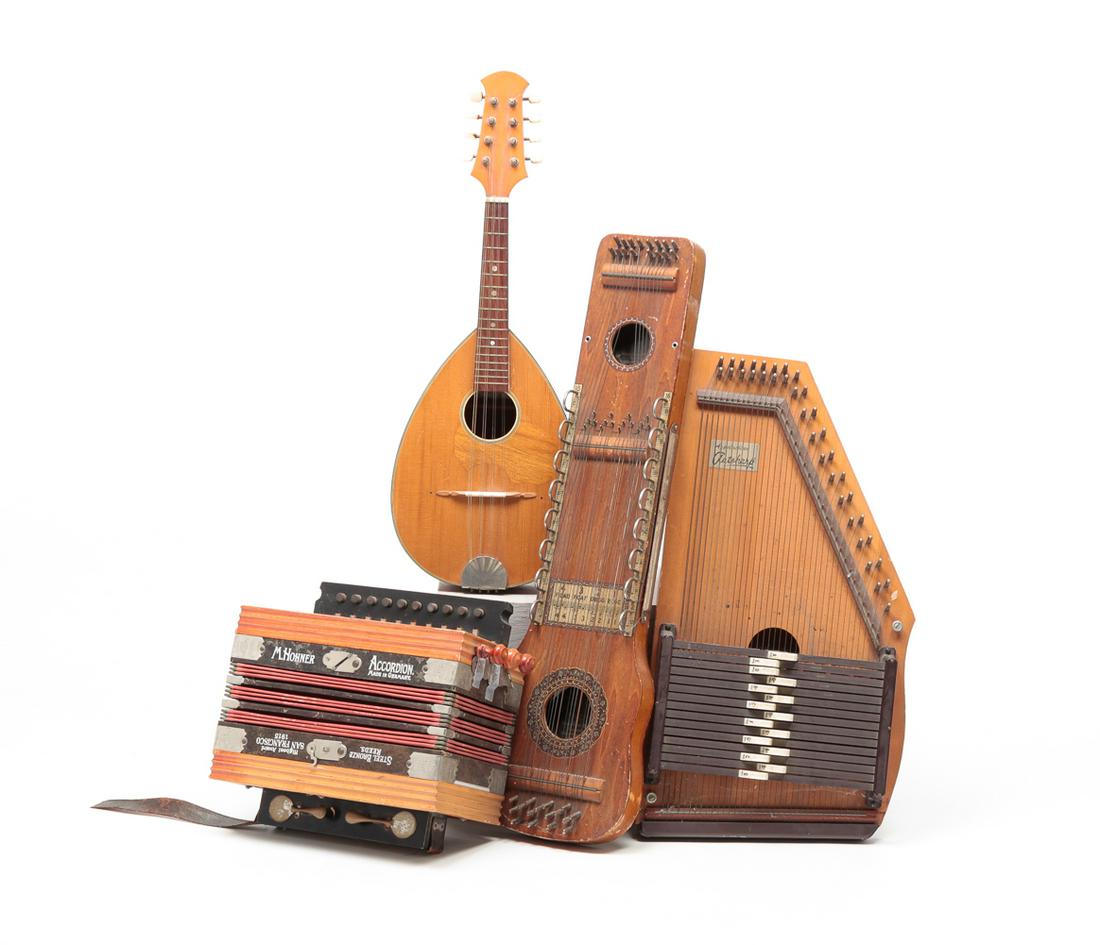 FOUR MUSICAL INSTRUMENTS INCLUDING ACCORDION. (1 of 11)