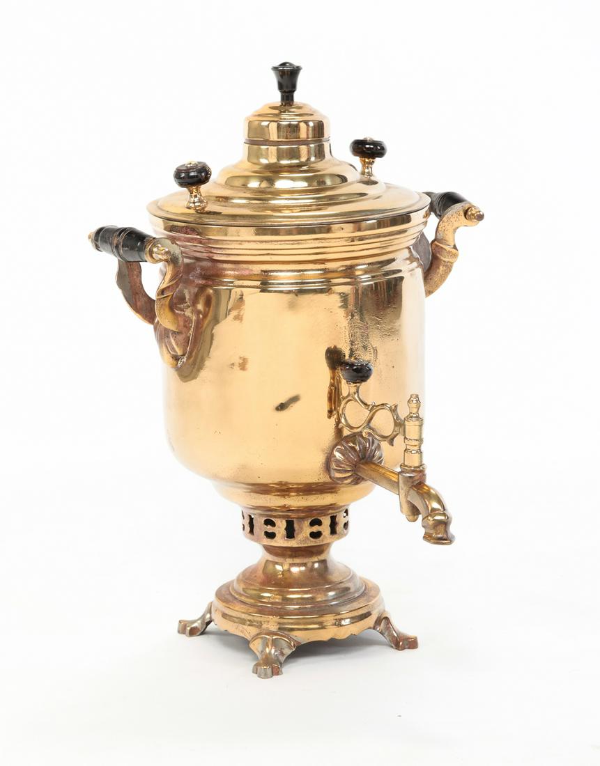RUSSIAN SAMOVAR.: Circa 1900, brass Typical shape with impressed mark over spout. Polished and missing stack. 18"h.
