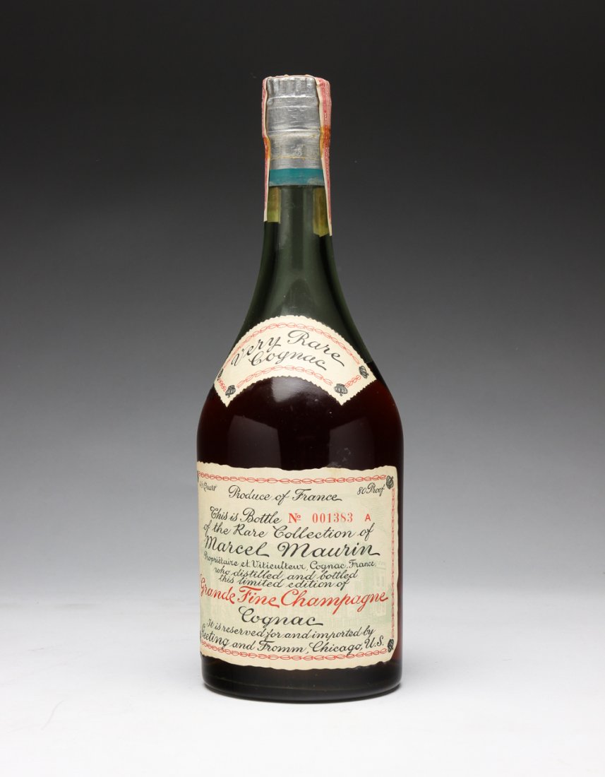NV MARCEL MAURIN GRANDE FINE CHAMPAGNE COGNAC.: France, ca 1944-50. Rare unopened bottle, 80 proof, 4/5 quart. Bottle is number 001383 A, reserved for and imported by Geeting and Fromm, Chicago. Sealed with red US Internal Revenue tax strip bearing