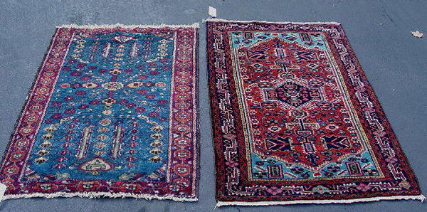 TWO ORIENTAL RUGS. Hamadans. One has a: TWO ORIENTAL RUGS. Hamadans. One has a midnight blue border, light blue spandrels and rust ground. 2'7" x 4'1". The other has a mottled red border and blue ground. Partial border loss. 2'7" x 3'9".