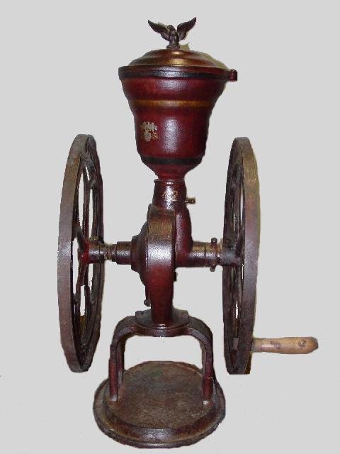 "ELGIN NATIONAL COFFEE MILL". Worn red.: "ELGIN NATIONAL COFFEE MILL". Worn red. Eagle finial. No bin. The number "42" is on the column. 28 1/4"h.