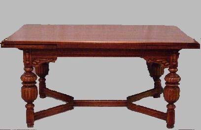 OAK JACOBEAN STYLE DINING SET. Eight pi: OAK JACOBEAN STYLE DINING SET. Eight pieces. Sideboard. 65"w. 20"d. 35 3/4"h. Table with pullout leaves on each end. 62"w 40"d. 30 3/4"h. And, six chairs: one arm and five sides.