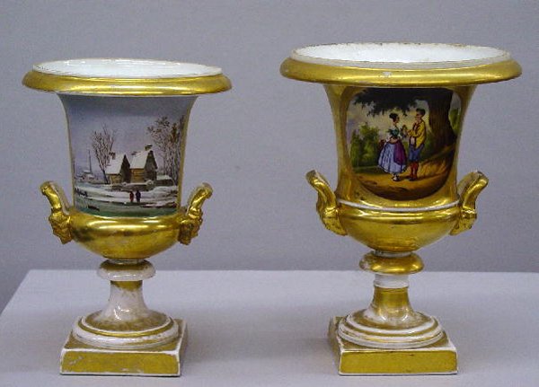 TWO OLD PARIS URNS. Porcelain with gildi