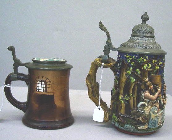 TWO STEINS. One has relief scenes of soldiers and