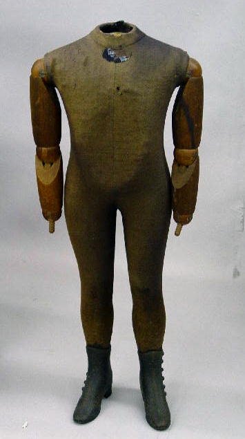 CHILD'S MANNEQUIN. Cast iron high button shoes wit