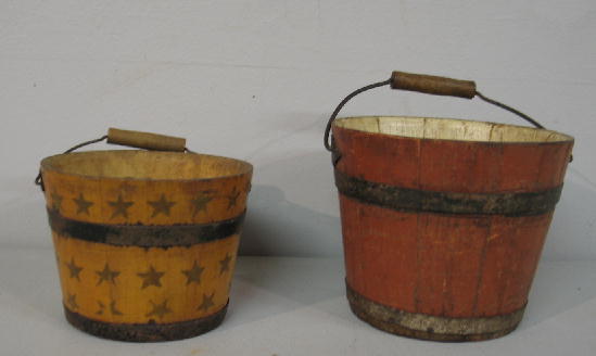 TWO MINIATURE BUCKETS. Probably Shaker. One has st: TWO MINIATURE BUCKETS. Probably Shaker. One has stenciled stars and has been revarnished. 4 1/2"d. 3 1/2"h. The other has original red and white paint. Wear. 5 1/2"d. 4 1/2"h. Both have bale handles w