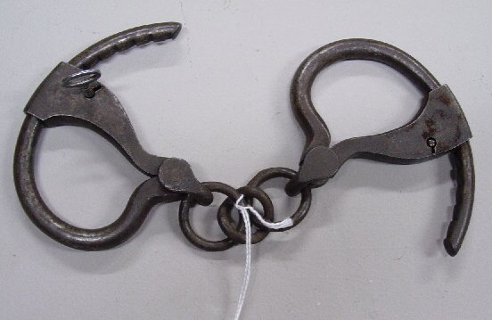 EARLY WROUGHT IRON HANDCUFFS. "Pat'd. Ju