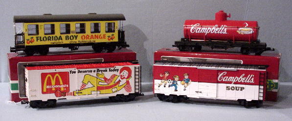 FOUR LGB G SCALE PIECES. Three boxcars: Campbells: FOUR LGB G SCALE PIECES. Three boxcars: Campbells (3098) Florida Boy Orange (3072) and McDonalds (44910). And a Campbells tanker (44800). All in original boxes.