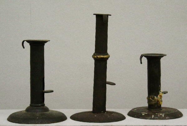THREE HOGSCRAPER CANDLESTICKS. All have push ups a