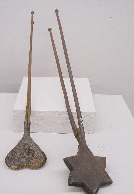 TWO CAST IRON WAFFLE IRONS. Heart, 28"l. and flora: TWO CAST IRON WAFFLE IRONS. Heart, 28"l. and floral star, 33"l.