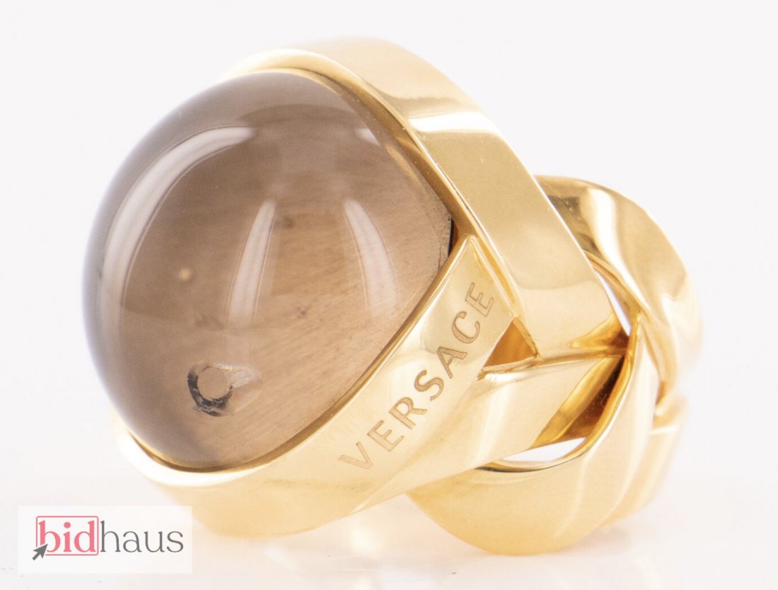 Versace Bauble Braided Ring Size 7.5: Brand - Versace Design Element - Quartz Width - 23.5mm Size - 7.5 Material - Solid Gold; Purity - 18k / 750; Colored Stone Type - Smoky Quartz Colored Stone Color - Brown Colored Stone Clarity - Tansp
