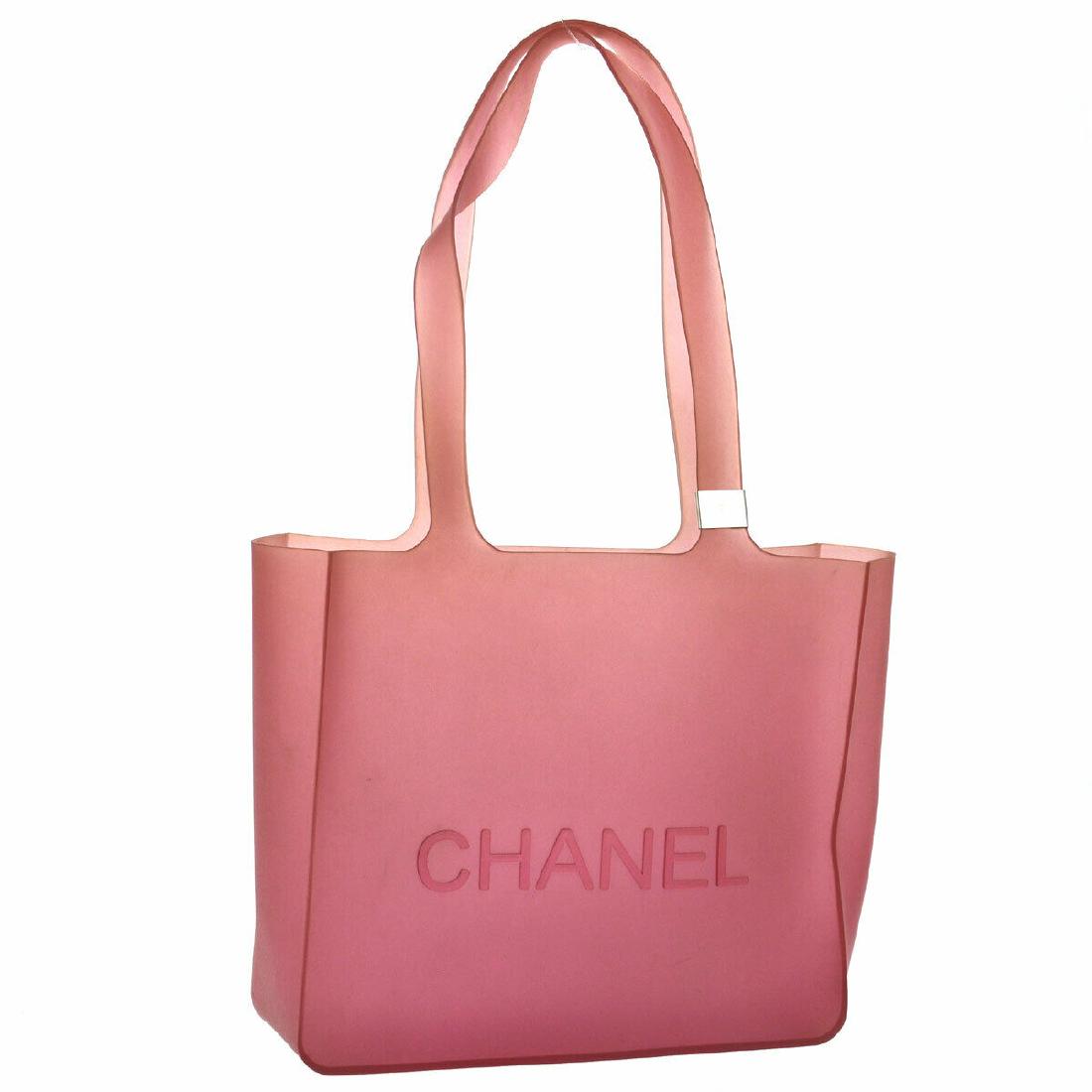 CHANEL SHOULDER TOTE BAG: Size: Medium Modified Item: No Style: Shoulder Tote Bag Depth: 3.0 Material: Rubber Width: 9.6 Color: Red Strap Drop: 9.3 Closure: Open Height: 8.3 Brand: CHANEL All Bidhaus items come with an Authent