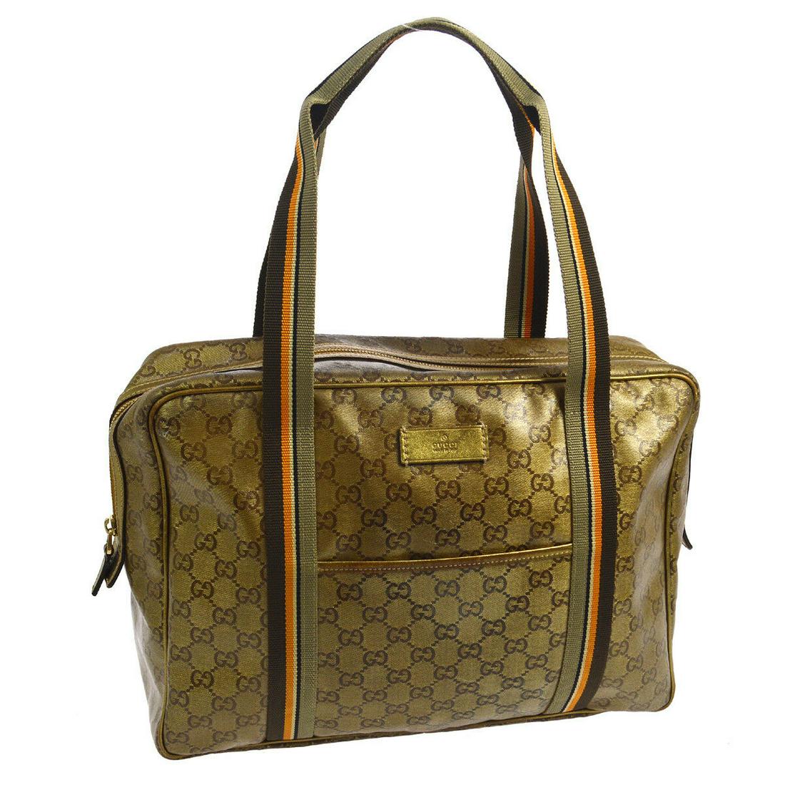 GUCCI 2WAY TOTE BAG: Size: Medium Bag Height: 10.0 Bag Depth: 3.9 Bag Length: 13.4 Style: 2way Tote Bag Material: Vinyl, Leather Country of Manufacture: Italy Color: Gold, etc Closure: Zipper Brand: Gucci All Bidhaus item