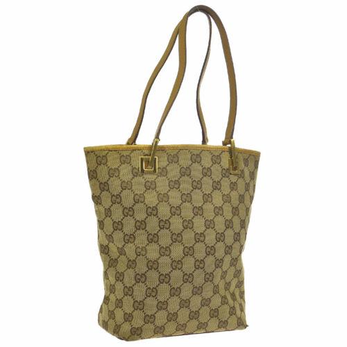 GUCCITote: Brand: Gucci Style: Shoulder Tote Bag Material: Canvas, Leather Color: Beige Size: Medium Width: 6.7 Height: 9.4 Depth: 3.5 Country of Origin: Italy Comes With: NA