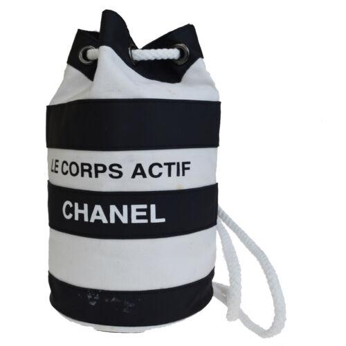 CHANEL Shoulder Bag: Brand: CHANEL Style: Shoulder Bag Material: Canvas, Nylon Color: Black White Size: Medium Width: 5.9 Height: 9.8 Depth: 5.1 Country of Origin: Comes With: All Bidhaus items come with a 10