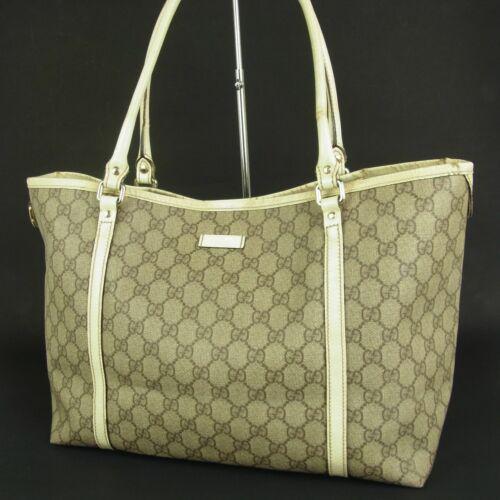 GUCCI Tote: Brand: Gucci Style: Tote Material: PVC Color: Grey/Beige Size: Large Width: 13-16.5 Height: 9.8 Depth: 5.5 Country of Origin: Italy Comes With: