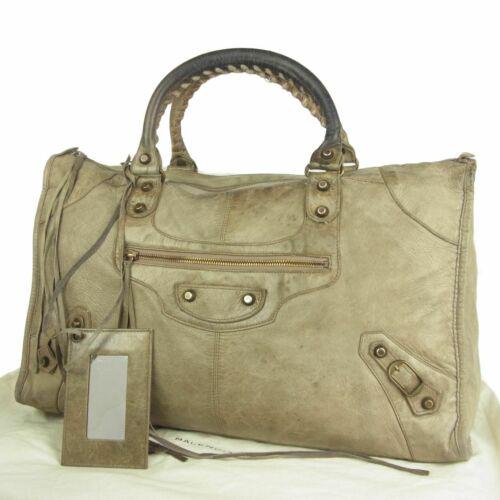 BALENCIAGA Hand Bag: Brand: Balenciaga Style: 'The Work' 132110 Hand Bag Material: Leather Color: Beige Size: Medium Width: 17.3 Height: 10.2 Depth: 7.1 Country of Origin: Italy Comes With: Mirror