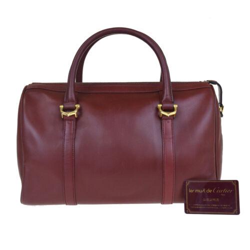 Cartier Travel Bag: Brand: carier Style: Material: Leather Color: Bordeaux Size: Medium Width: 13.4 Height: 7.9 Depth: 6.3 Country of Origin: Spain Comes With: All Bidhaus items come with a 100% money back a