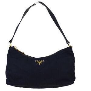 Prada , Handbag: Brand: Prada Style: Handbag Material: Nylon, Leather Color: Black Size: 4.33'' x 8.26'' x 3.54'' Width: Height: Depth: Country of Origin: Italy Comes With: All Bidhaus items come with a 100% money