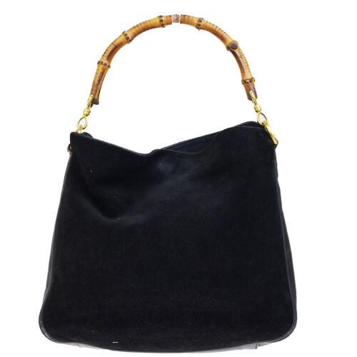 GUCCI Bamboo Hand Bag: Brand: Gucci Style: Shoulder Hand Bag Material: Bamboo, Suede Skin leather Color: Black Size: Medium Width: 10.6 Height: 9.4 Depth: 2.8 Country of Origin: Comes With: All Bidhaus items come with a 1