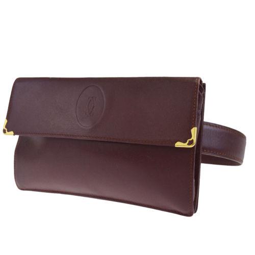 Must De Cartier Bum Bag: Brand: Gucci Style: Bum Bag Material: Leather Color: Bordeaux Size: Width: 6.9 Height: 4.3 Depth: 1.2 Strap Drop:24.4 - 27.6 Country of Origin: Small Comes With: 24.4 - 27.6 All Bidhaus items come wit