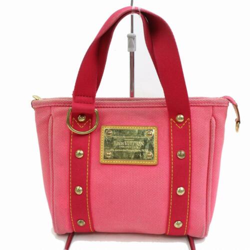 Authenticentic Louis Vuitton Tote Bag: Brand: Louis Vuitton Style: Tote Bag Material: Canvas Color: Hot Pink Size: Width: 9.05 inch(approx) /23 cm(approx) Height: 8.26 inch(approx) /21 cm(approx) Depth: 2.36 inch(approx) /6 cm(approx) Coun