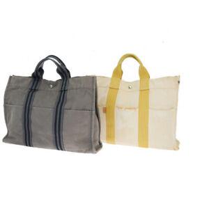 Authentic Hermes Fourre Tout 2-piece Set MM Canvas Tote: Brand: Hermes Style: Tote bag Material: Canvas Color: Gray Size: Width: Height: Depth: Country of Origin: France Comes With: All Bidhaus items come with a 100% money-back authenticity guarantee. Pleas