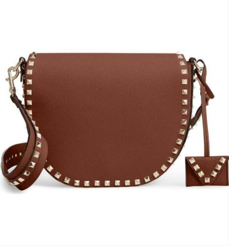 Authentic Valentino Crossbody Rockstud: Brand: Valentino Style: Rockstud Saddle Shoulder Bag Material: Leather Color: Browns Size: Width: Small Height: 7 Depth: 2.5 Strap Drop: 7 Country of Origin: Italy Comes With: All Bidhaus