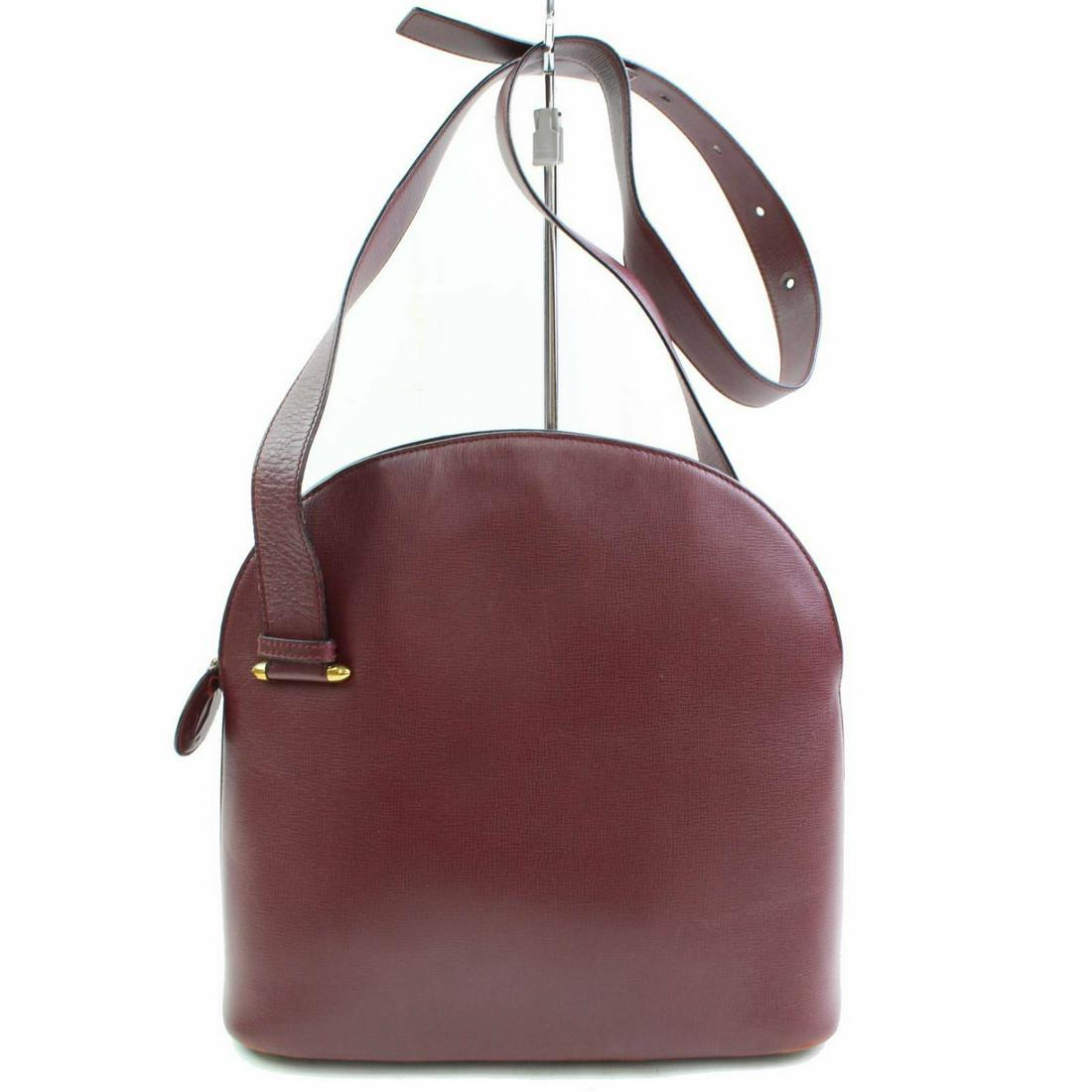 Authentic Cartier Leather Shoulder Bag: Brand: Cartier Style: Shoulder Bag Material: Leather Color: Bordeaux Size: Height: Depth: Width: Comes With: All Bidhaus items come with a 100% money-back authenticity guarantee. Please refer to image