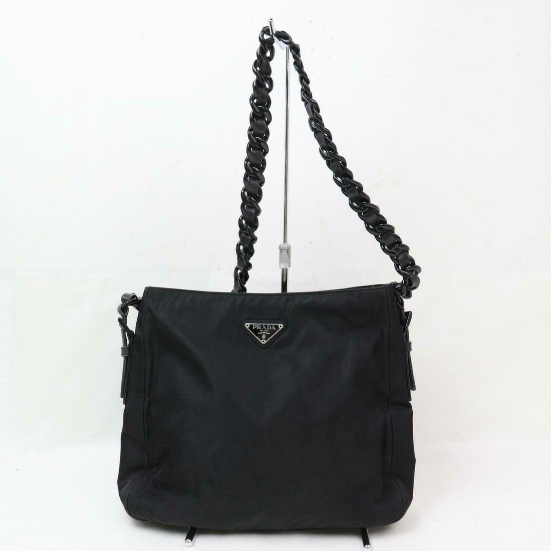 Authentic Prada Nylon Shoulder Bag: Brand: Prada Style: Shoulder Bag Material: Nylon Color: Black Size: Height: 9.84 inch(approx) /25 cm(approx) Depth: 2.75 inch(approx) /7 cm(approx) Width: 9.84 inch(approx) /25 cm(approx) Comes With: