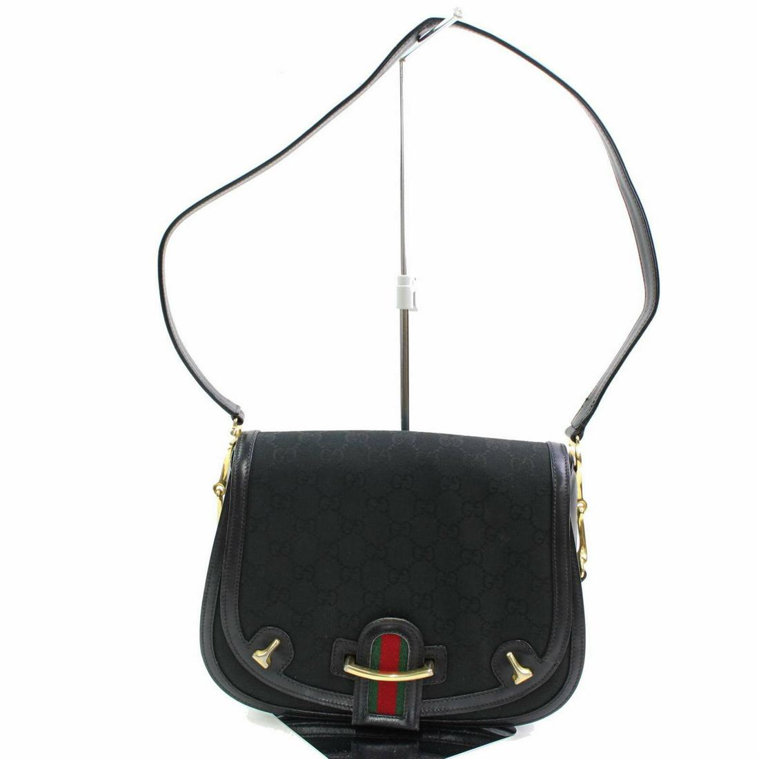 Authentic Vintage Gucci Canvas Shoulder Bag: Brand: Vintage Gucci Style: Shoulder Bag Material: Canvas Color: Black Size: Height: Depth: Width: Comes With: All Bidhaus items come with a 100% money-back authenticity guarantee. Please refer to ima