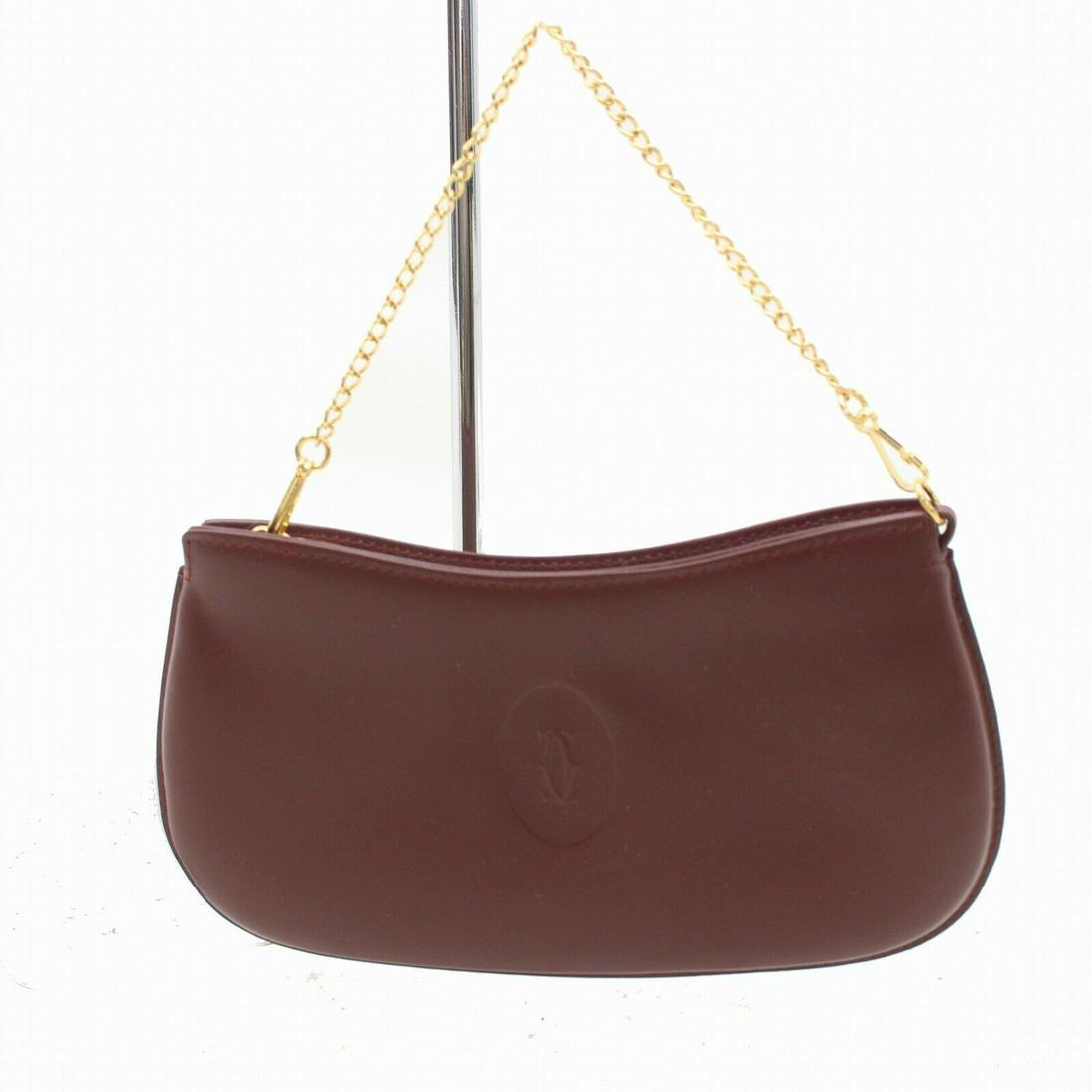 Authentic Cartier Leather Accessories Pouch: Brand: Cartier Style: Accessories Pouch Material: Leather Color: Bordeaux Size: Height: Depth: Width: Comes With: All Bidhaus items come with a 100% money-back authenticity guarantee. Please refer to 